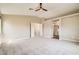Spacious main bedroom featuring neutral colored walls and plush carpet at 8469 Cheerful Brook Ave, Las Vegas, NV 89143