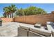 Private patio with outdoor seating and a built-in grill at 8469 Cheerful Brook Ave, Las Vegas, NV 89143