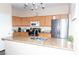 Spacious kitchen with stainless steel appliances, granite countertops, and ample cabinet space for easy meal preparation at 9303 Gilcrease Ave # 1077, Las Vegas, NV 89149