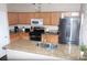 Well-equipped kitchen with stainless steel appliances, granite countertops, and ample cabinet space for easy meal preparation at 9303 Gilcrease Ave # 1077, Las Vegas, NV 89149