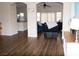 Open-concept living room with wood flooring, neutral paint, and comfortable seating area, creating a warm and inviting atmosphere at 9303 Gilcrease Ave # 1077, Las Vegas, NV 89149