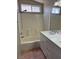 Bathroom with a shower-tub combination, double sink vanity, and neutral finishes at 951 Country Back Rd, Las Vegas, NV 89123