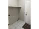 Laundry room with washer and dryer hookups and a door to the backyard at 951 Country Back Rd, Las Vegas, NV 89123