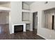Bright living room features a fireplace with white mantle and modern floors at 951 Country Back Rd, Las Vegas, NV 89123