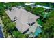 Expansive home showcasing a tile roof, landscaped backyard, and a sparkling swimming pool with a built-in spa at 9713 Highridge Dr, Las Vegas, NV 89134