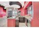 Open-concept bar area with granite countertop, sink, cabinets, and modern lighting fixtures at 9713 Highridge Dr, Las Vegas, NV 89134