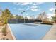 Outdoor community basketball court with lighting, fencing, and landscaping at 9713 Highridge Dr, Las Vegas, NV 89134