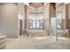 Bright primary bathroom boasts large tub, walk-in shower, and decorative lighting at 9713 Highridge Dr, Las Vegas, NV 89134