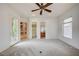 Large bedroom with soft carpet, double doors, and Primary bath entrance at 9713 Highridge Dr, Las Vegas, NV 89134