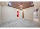 Spacious bedroom featuring soft carpet, ceiling fan, recessed lighting, and walk-in closet for ample storage at 9713 Highridge Dr, Las Vegas, NV 89134