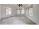 Bright Primary bedroom offers soft carpet and large windows that let in natural light at 9713 Highridge Dr, Las Vegas, NV 89134