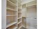 Walk-in closet featuring multiple shelves and racks for storage at 9713 Highridge Dr, Las Vegas, NV 89134