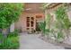 Elegant courtyard entrance featuring a central fountain, lush greenery, and a welcoming ambiance at 9713 Highridge Dr, Las Vegas, NV 89134