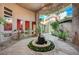 Picturesque courtyard featuring a central fountain, accented by vine-covered walls and a serene ambiance at 9713 Highridge Dr, Las Vegas, NV 89134