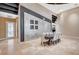 Open-concept dining area showcasing a large table, tiled flooring, and contemporary decor at 9713 Highridge Dr, Las Vegas, NV 89134