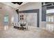 Spacious dining area features a large table and decorative wall, complemented by tiled floors at 9713 Highridge Dr, Las Vegas, NV 89134