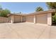 This spacious three-car garage offers ample parking and storage space with it's expansive driveway at 9713 Highridge Dr, Las Vegas, NV 89134