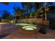 Backyard oasis with a luxurious pool featuring a waterfall feature and hot tub at 9713 Highridge Dr, Las Vegas, NV 89134