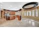 Gourmet kitchen with stainless steel appliances, custom cabinets, granite countertops, and a dining area at 9713 Highridge Dr, Las Vegas, NV 89134