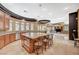 Gourmet kitchen with stainless steel appliances, granite island with seating, and custom cabinets at 9713 Highridge Dr, Las Vegas, NV 89134
