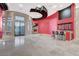 Large living area featuring a fireplace, wet bar, and expansive tile flooring at 9713 Highridge Dr, Las Vegas, NV 89134