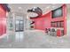 Spacious living room boasts a stylish wet bar, striking architectural features, and large windows at 9713 Highridge Dr, Las Vegas, NV 89134