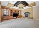 Cozy living room featuring built-in entertainment center, fireplace, and access to the outdoor patio at 9713 Highridge Dr, Las Vegas, NV 89134