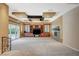 Bright living room with custom ceiling, fireplace, entertainment center, and sliding glass doors to yard at 9713 Highridge Dr, Las Vegas, NV 89134