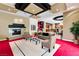 Spacious living room with a modern fireplace, elegant seating, and a view of the gourmet kitchen at 9713 Highridge Dr, Las Vegas, NV 89134