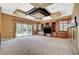 Spacious living room with custom built-ins, fireplace, and sliding doors to the outside at 9713 Highridge Dr, Las Vegas, NV 89134