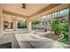 The spacious covered patio includes lush landscaping, offering an ideal spot for relaxation and outdoor living at 9713 Highridge Dr, Las Vegas, NV 89134