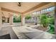 The spacious covered patio includes lush landscaping, offering an ideal spot for relaxation and outdoor living at 9713 Highridge Dr, Las Vegas, NV 89134