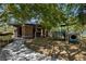 A shady community playground with seating, play structure, and wood chip ground cover at 9713 Highridge Dr, Las Vegas, NV 89134