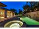 Backyard with a luxurious pool featuring a waterfall feature and hot tub, and outdoor seating at 9713 Highridge Dr, Las Vegas, NV 89134