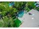 Real estate aerial view of a backyard pool with waterfall features and lush landscaping, creating a private oasis at 9713 Highridge Dr, Las Vegas, NV 89134