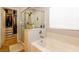 Bathroom featuring a glass shower, soaking tub, closet with built-ins, and natural light at 9925 Turquoise Glass Ct, Las Vegas, NV 89178