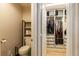 Bathroom featuring a toilet and built in closet, with shelving and storage at 9925 Turquoise Glass Ct, Las Vegas, NV 89178
