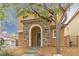 Attractive two-story home showcasing a stone-accented entrance and easy-care landscaping at 9925 Turquoise Glass Ct, Las Vegas, NV 89178