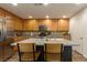 Kitchen featuring stainless steel appliances and a center island with bar stool seating at 9925 Turquoise Glass Ct, Las Vegas, NV 89178