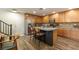 Bright kitchen with stainless steel appliances and island seating at 9925 Turquoise Glass Ct, Las Vegas, NV 89178