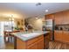 Kitchen with stainless steel appliances, ample cabinet space, and island seating at 9925 Turquoise Glass Ct, Las Vegas, NV 89178