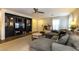 Modern living room with dark built-ins, a comfortable sectional sofa, and stylish accents at 9925 Turquoise Glass Ct, Las Vegas, NV 89178