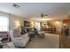 Open-concept living area featuring stylish furnishings and a dining area with ample natural light at 9925 Turquoise Glass Ct, Las Vegas, NV 89178