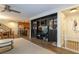 Open-concept living area with stylish built-ins, dining area, and modern furnishings at 9925 Turquoise Glass Ct, Las Vegas, NV 89178