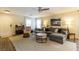 Cozy living room featuring a comfortable sectional sofa and elegant decor at 9925 Turquoise Glass Ct, Las Vegas, NV 89178