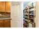 Walk-in pantry with multiple shelves for ample storage at 9925 Turquoise Glass Ct, Las Vegas, NV 89178