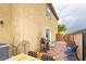 Outdoor patio with grill, table and chairs, and view of the yard at 9925 Turquoise Glass Ct, Las Vegas, NV 89178