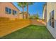 The backyard features low-maintenance artificial turf and privacy walls at 10931 Sardinia Sands Dr, Las Vegas, NV 89141