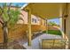 A charming patio features a seating area and a green lawn at 10931 Sardinia Sands Dr, Las Vegas, NV 89141