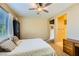 Spacious carpeted bedroom with natural light and desk at 10931 Sardinia Sands Dr, Las Vegas, NV 89141